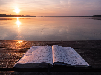 "Book On Top Of Table and Body of Water," Photo by Aaron Burden on Unsplash "Book On Top Of Table and Body of Water," Photo by Aaron Burden on Unsplash